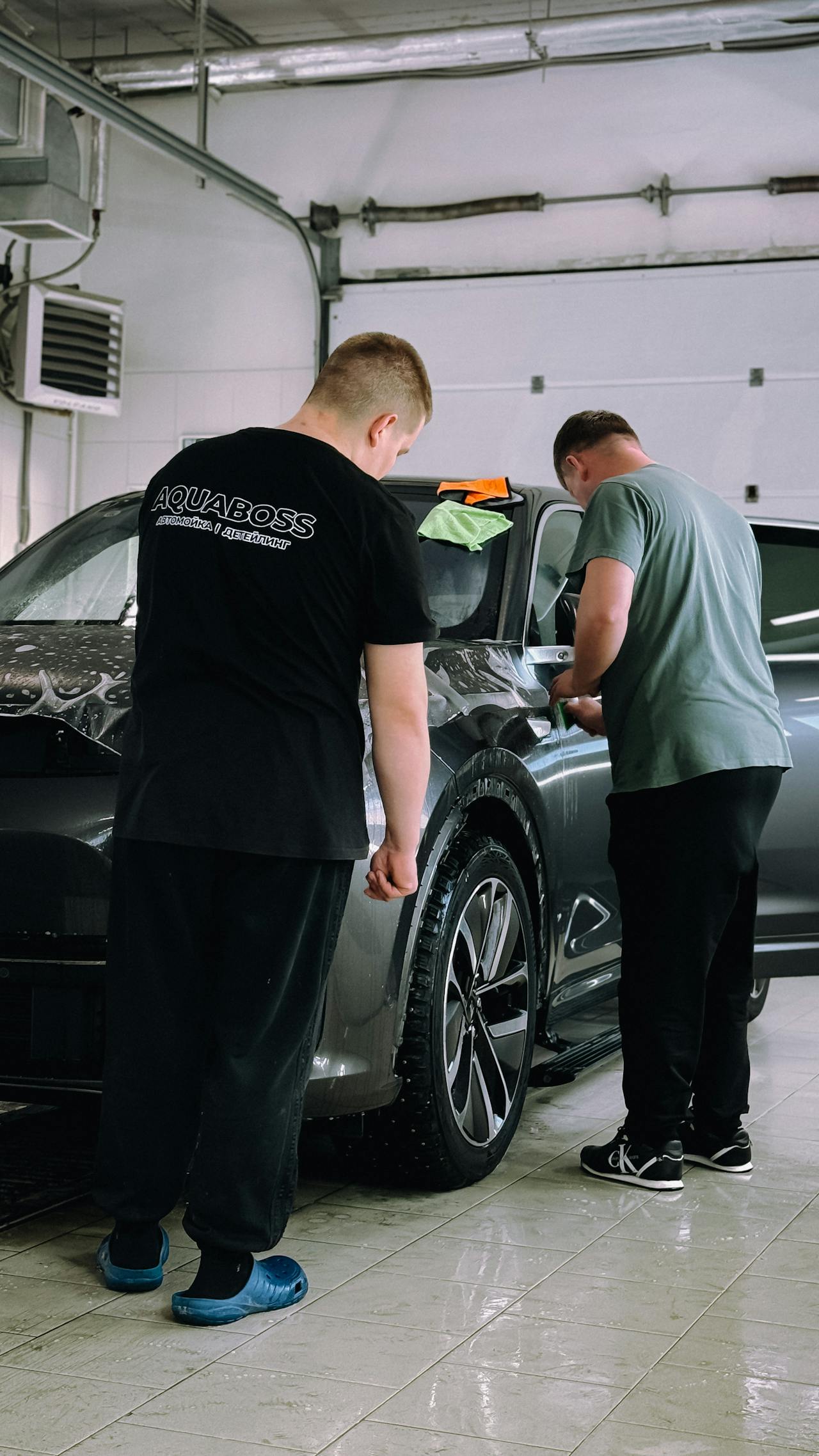 Photo by Bulat843 @prayfor843 TG: https://www.pexels.com/photo/car-detailing-professionals-working-indoors-31154217/