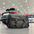 Vertool PRO-XL detailing bag loaded and standing beside a car in a detailing studio