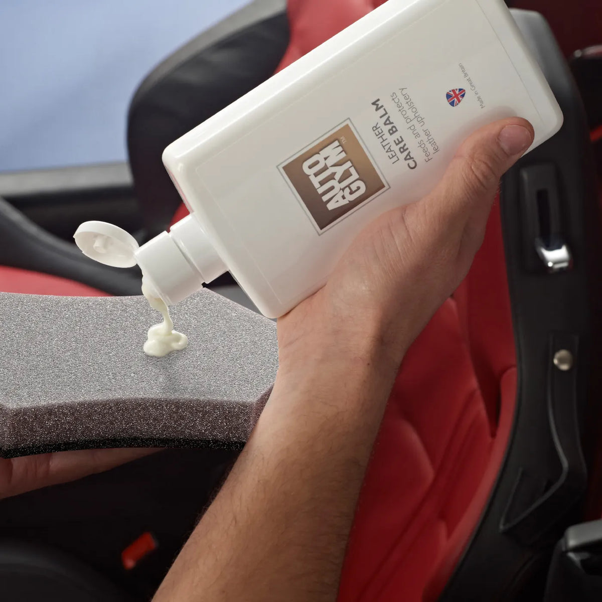 Autoglym Leather Care Balm 500ml being applied to a foam applicator
