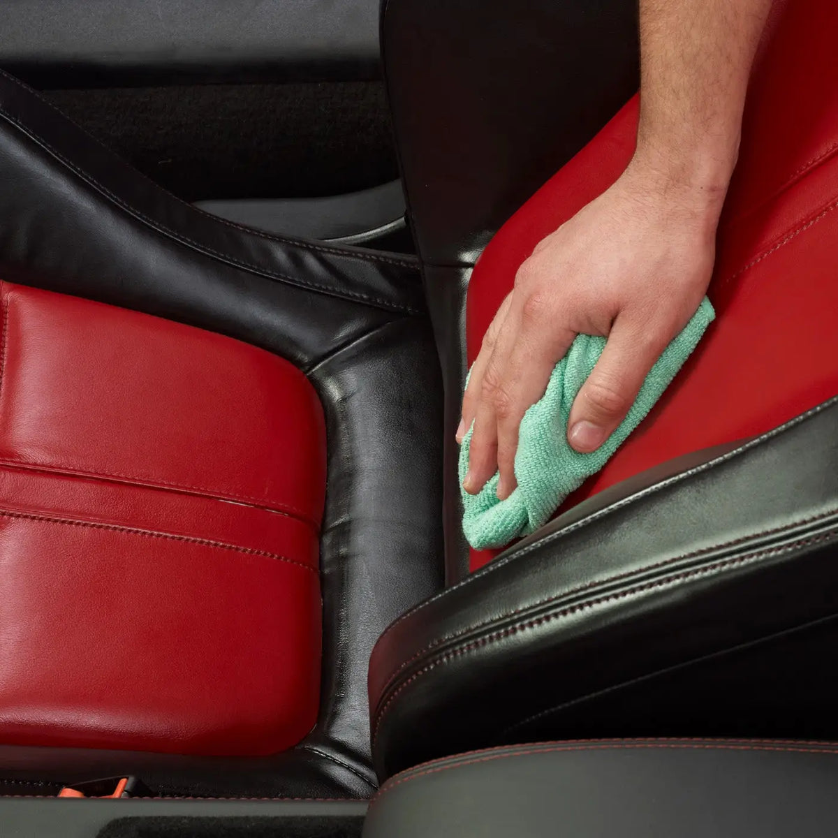 Leather car seat buffed with a microfibre cloth after Autoglym Leather Care Balm