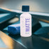 Gyeon Q² Matte EVO Light 50ml bottle with suede applicator on a car panel