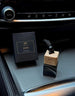 Aromatic 89 Hanging Glass Air Freshener 8ml Dore, bottle and box on the centre console
