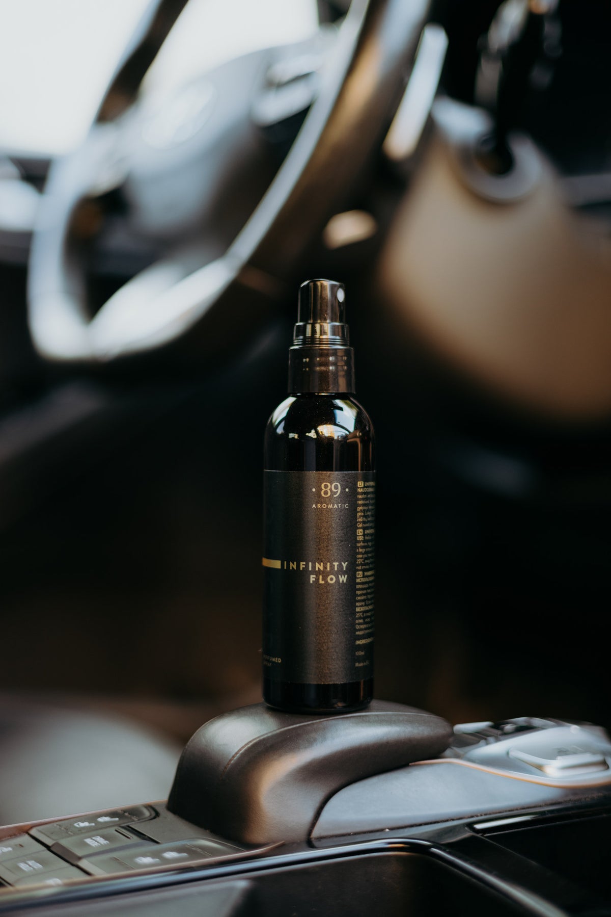 Aromatic 89 Car Perfume Spray 100ml, bottle on the gear selector