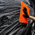 CarPro PolyShave towel being used on a foam-covered car panel