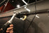 Rupes iBrid Nano Extension Bar in use polishing behind a door handle with a wool pad