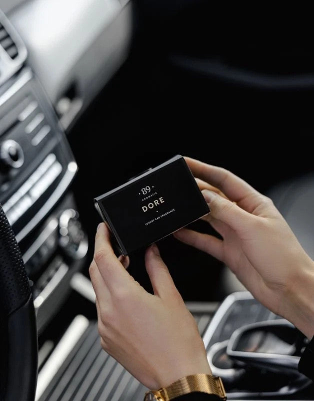 Aromatic 89 Car Air Freshener Vent Clip Dore, opening the gift box in the car