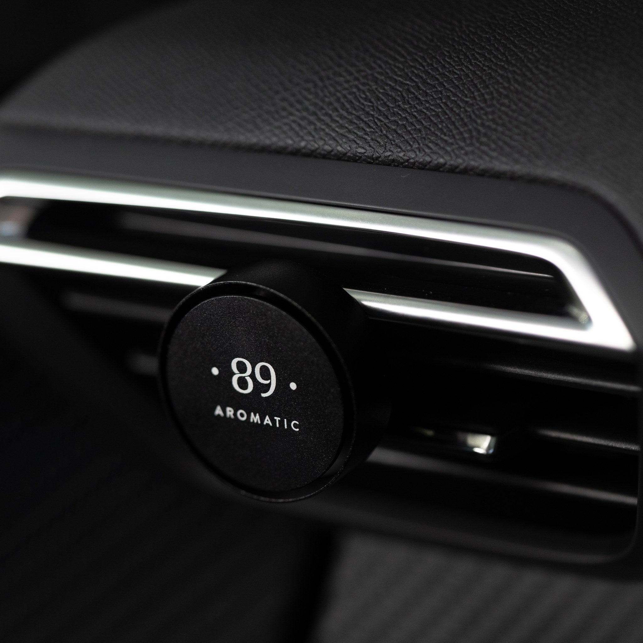 Aromatic 89 Car Air Freshener Vent Clip, clip fitted to an air vent