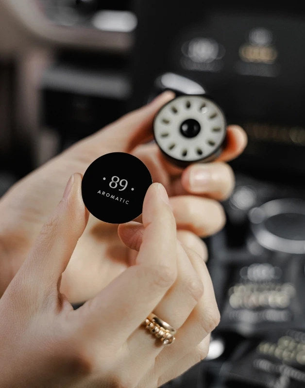 Aromatic 89 Car Vent Clip Refill, capsule and holder in hand